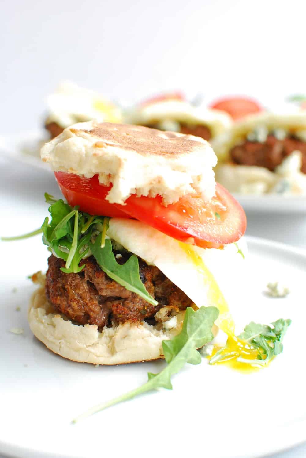 A big breakfast burger with a runny egg yolk