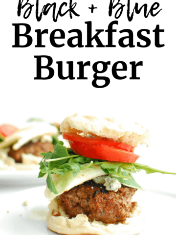 A breakfast black and blue burger served on an English muffin