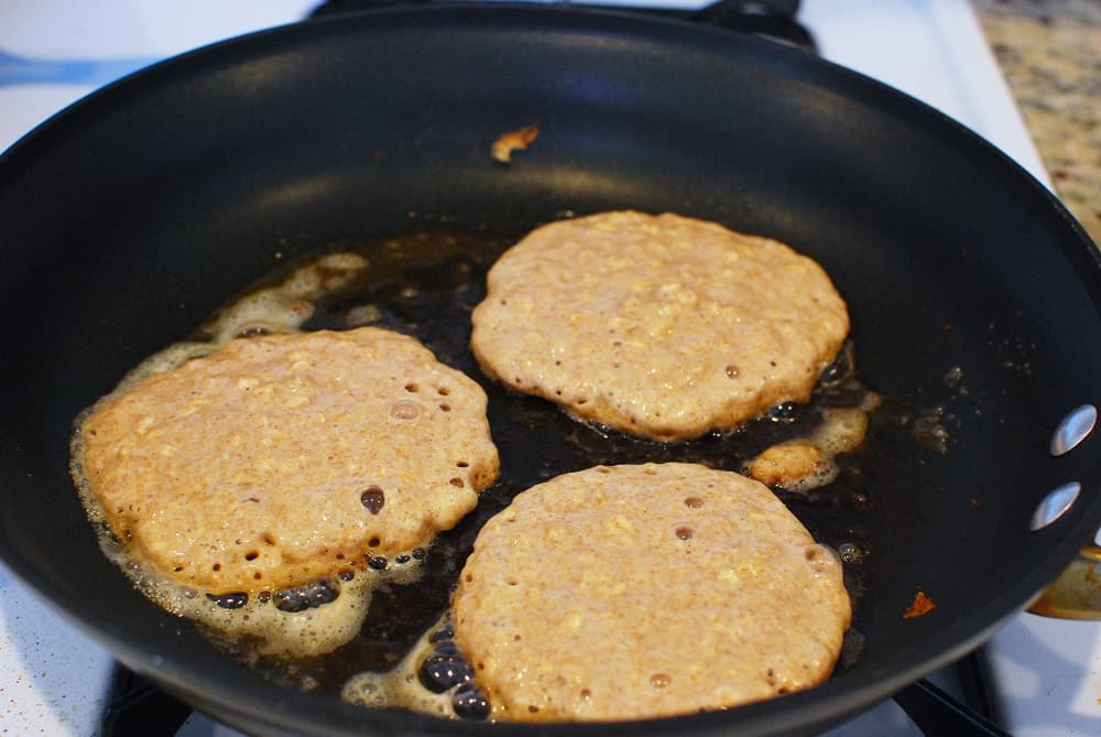 Healthy pancakes cooking in a skillet