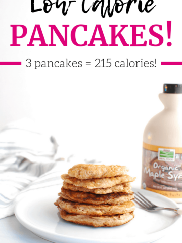 A stack of low calorie pancakes next to a bottle of maple syrup