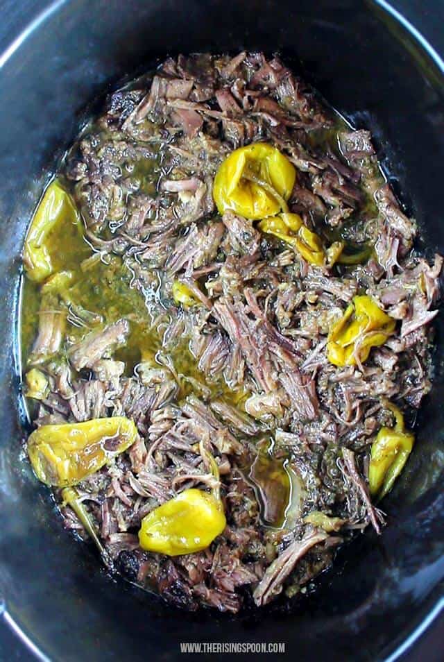 Shredded crockpot Mississippi pot roast with banana peppers.