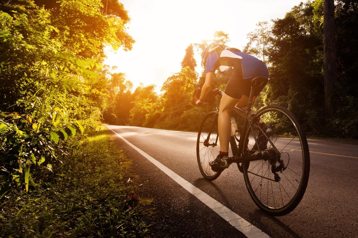 female cyclist riding outdoors