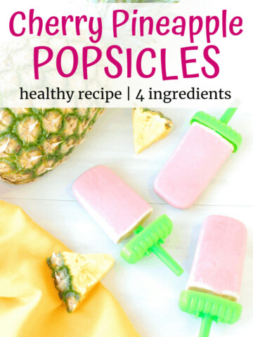Three homemade popsicles next to a pineapple and yellow napkin