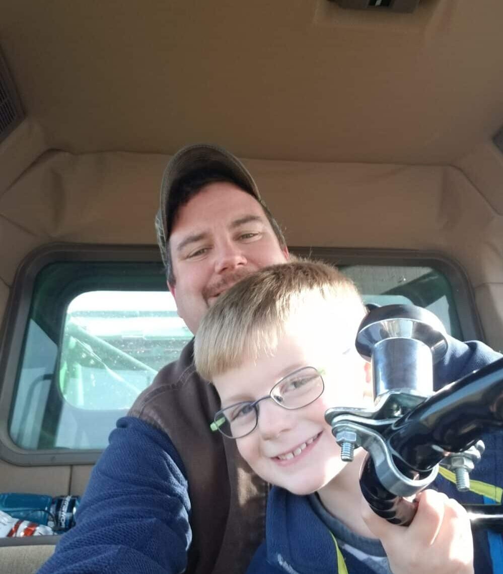 Potato farmer in Maine with his child