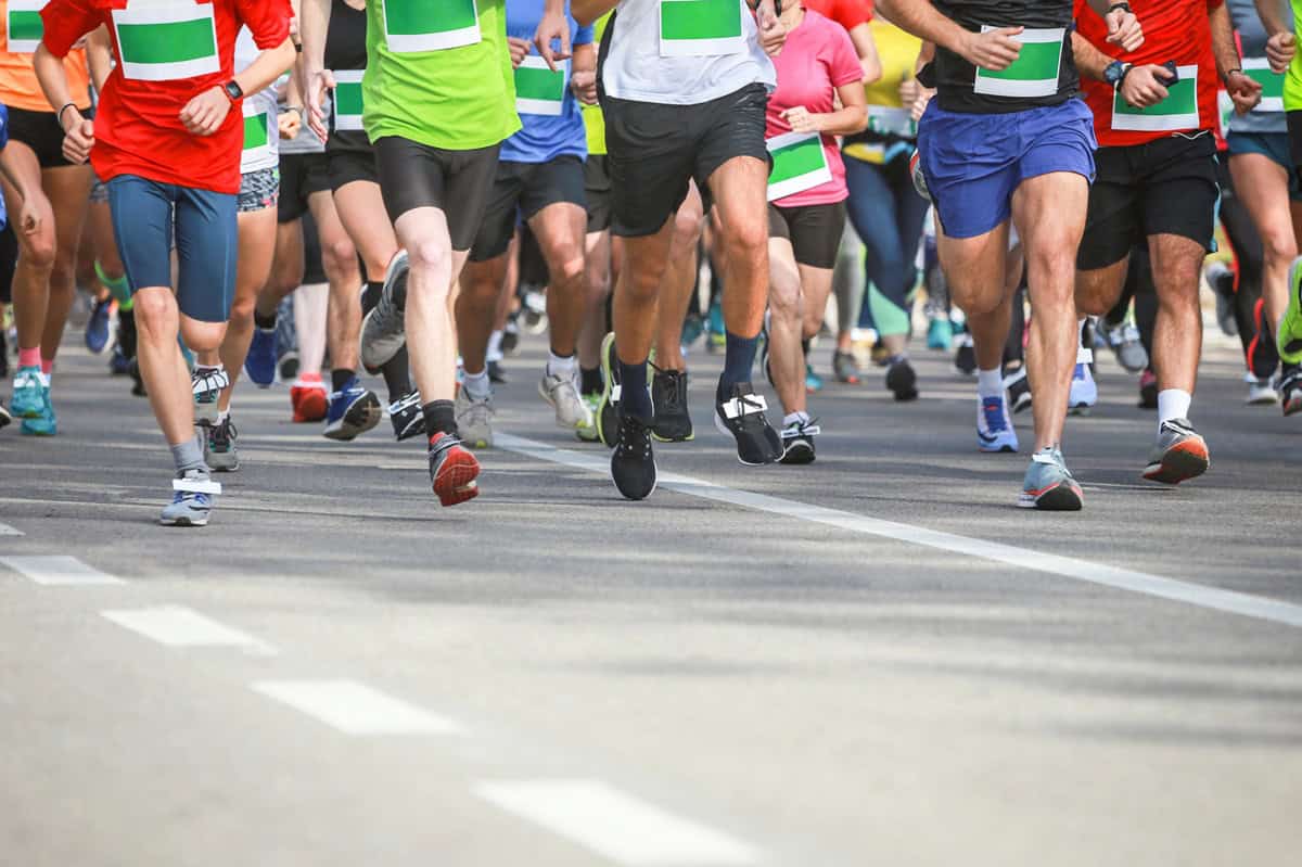 A group of runners starting a half marathon race.
