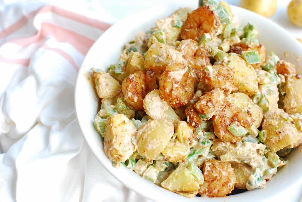 Cajun potato salad in a white bowl