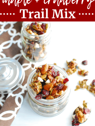 fall trail mix in a small jar next to a spoonful of trail mix