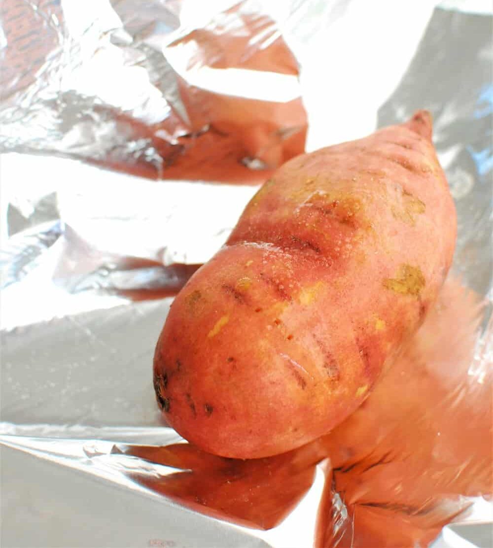 A sweet potato on foil 