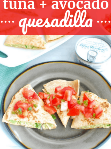 tuna quesadillas on a black plate topped with pico de gallo