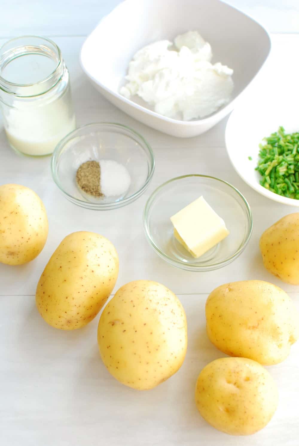 Potatoes, butter, salt, pepper, greek yogurt, milk, and chives - all ingredients