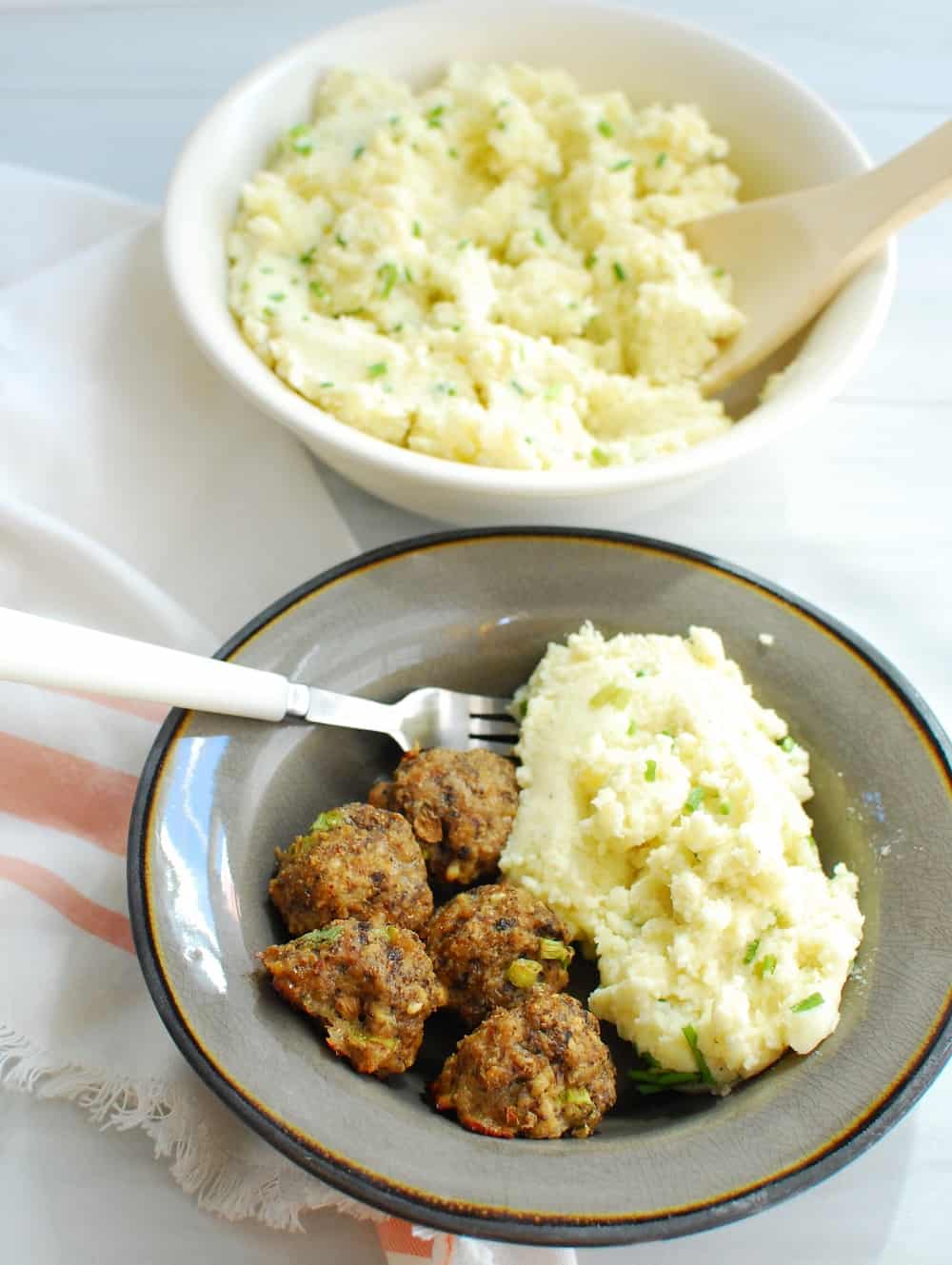 meatballs with greek yogurt mashed potatoes in a bowl