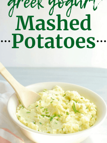 Greek yogurt mashed potatoes with chives in a serving bowl