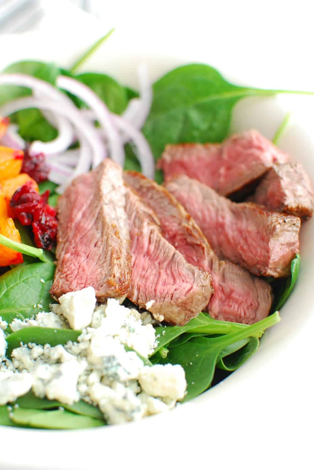 close up of the steak in a steak and blue cheese salad