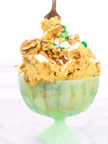 A bowl of chickpea cookie dough hummus with a fork stuck in the top.