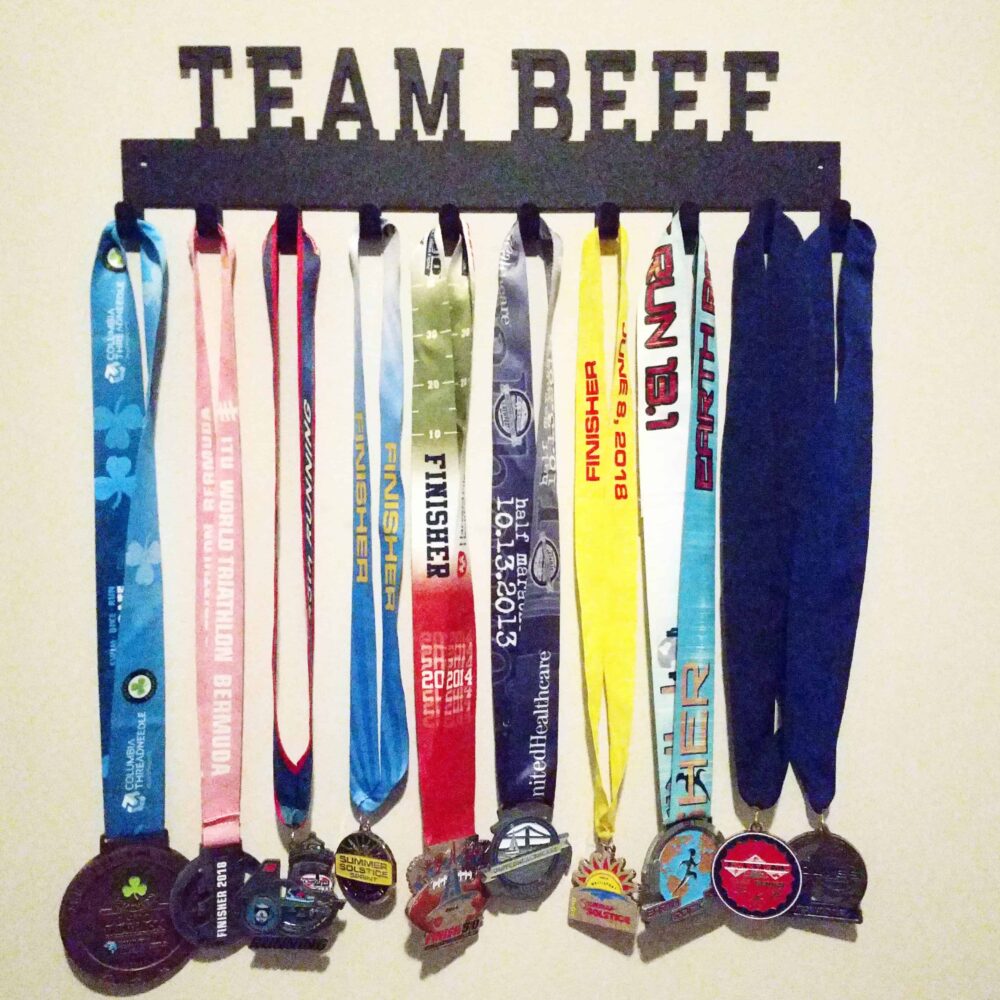 A medal rack to hang up triathlon and road race medals.