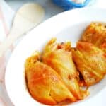 Hungarian stuffed cabbage rolls on a white dish.
