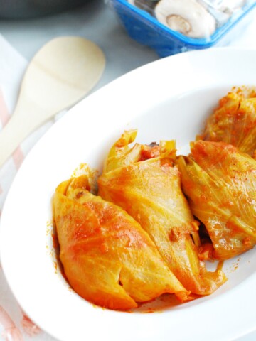 Hungarian stuffed cabbage rolls on a white dish.