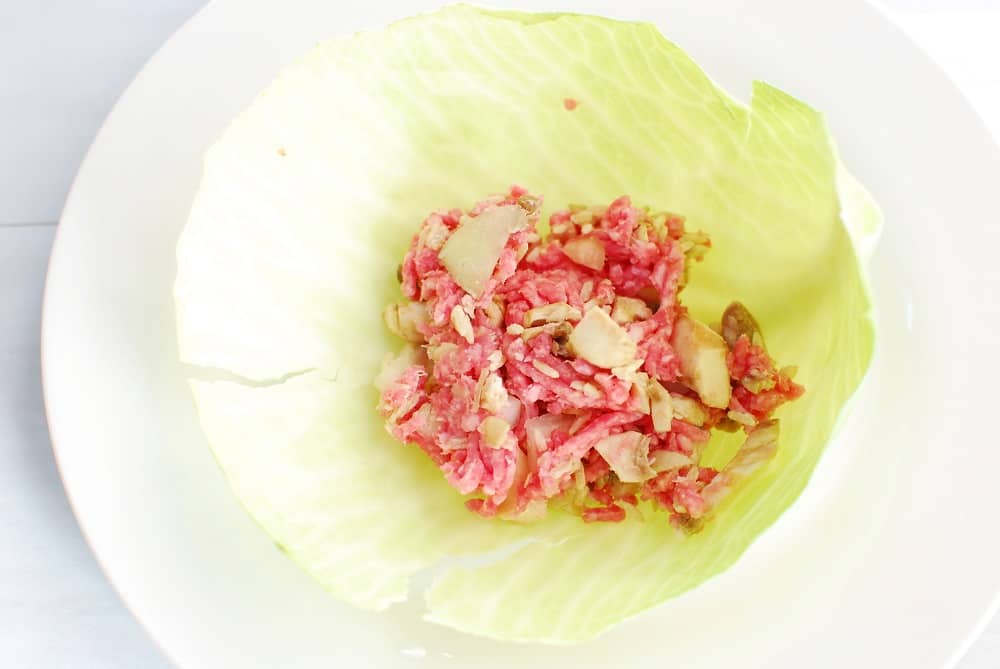 Pork, rice, and mushroom filling in a cabbage leaf