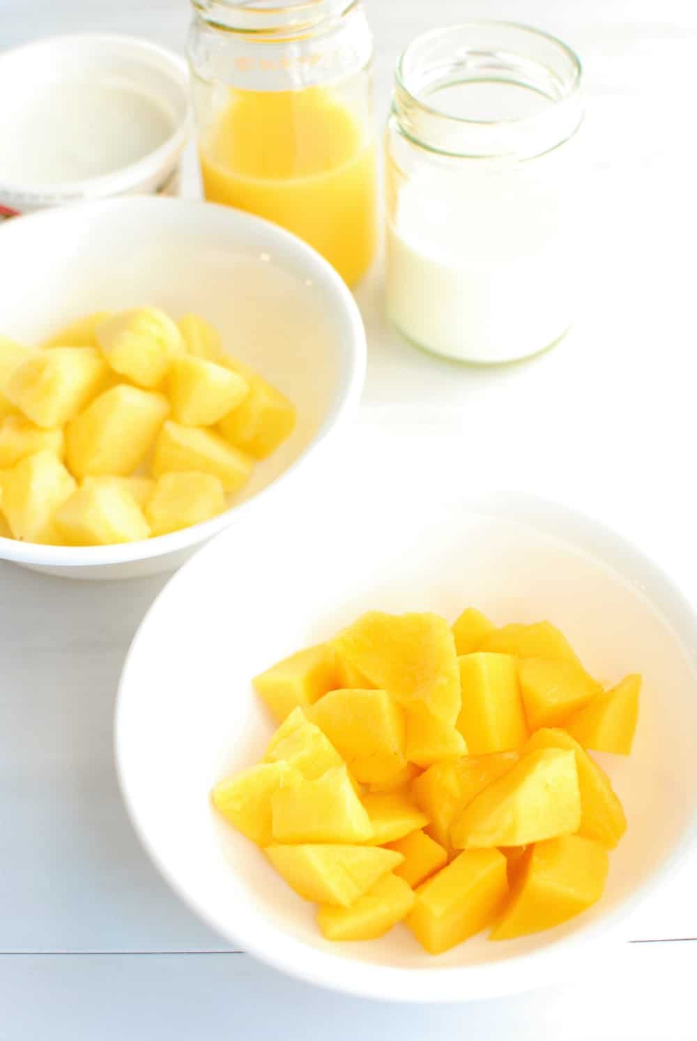 Ingredients to make a mango pineapple smoothie