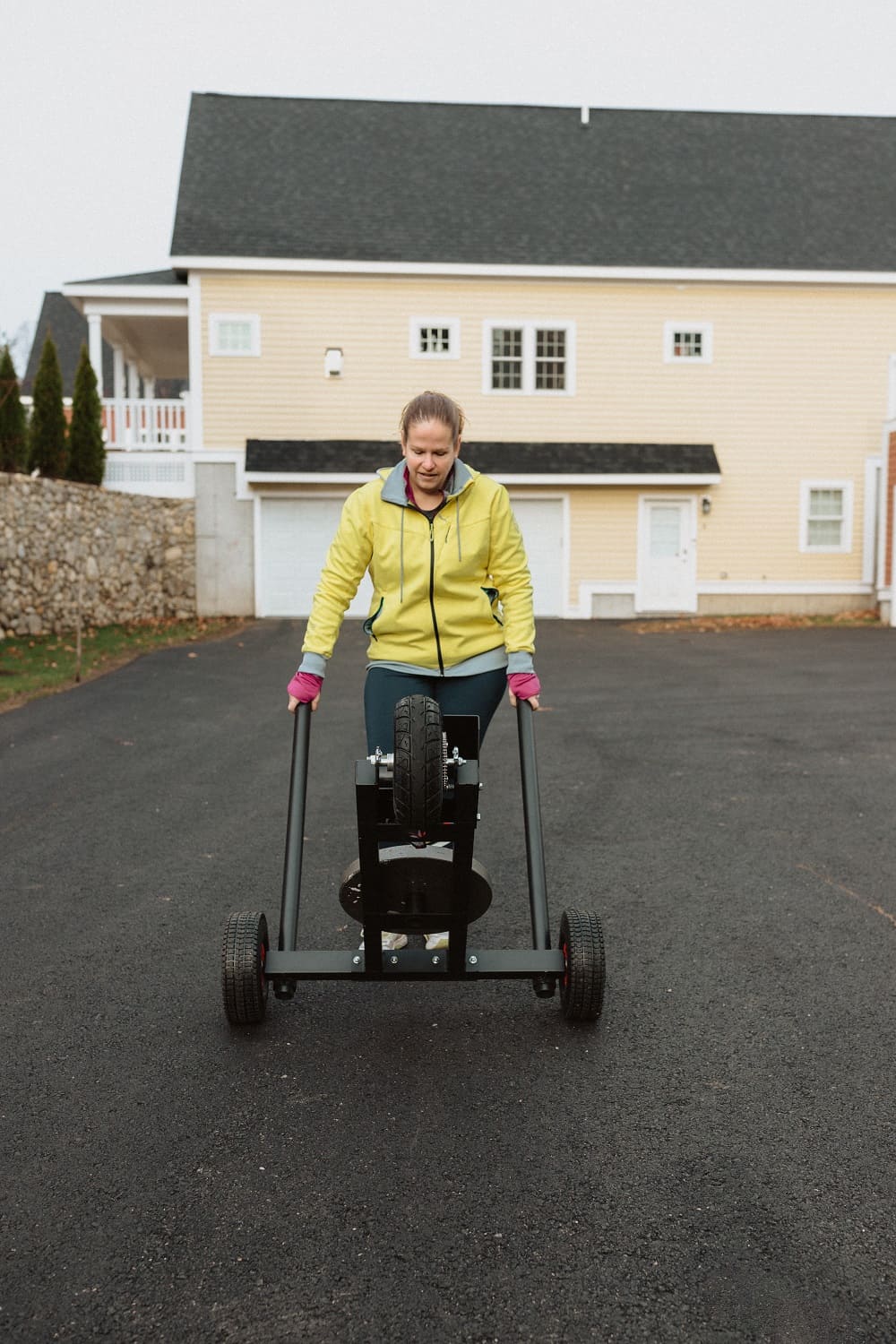 a woman wheeling the XPO trainer push sled easily