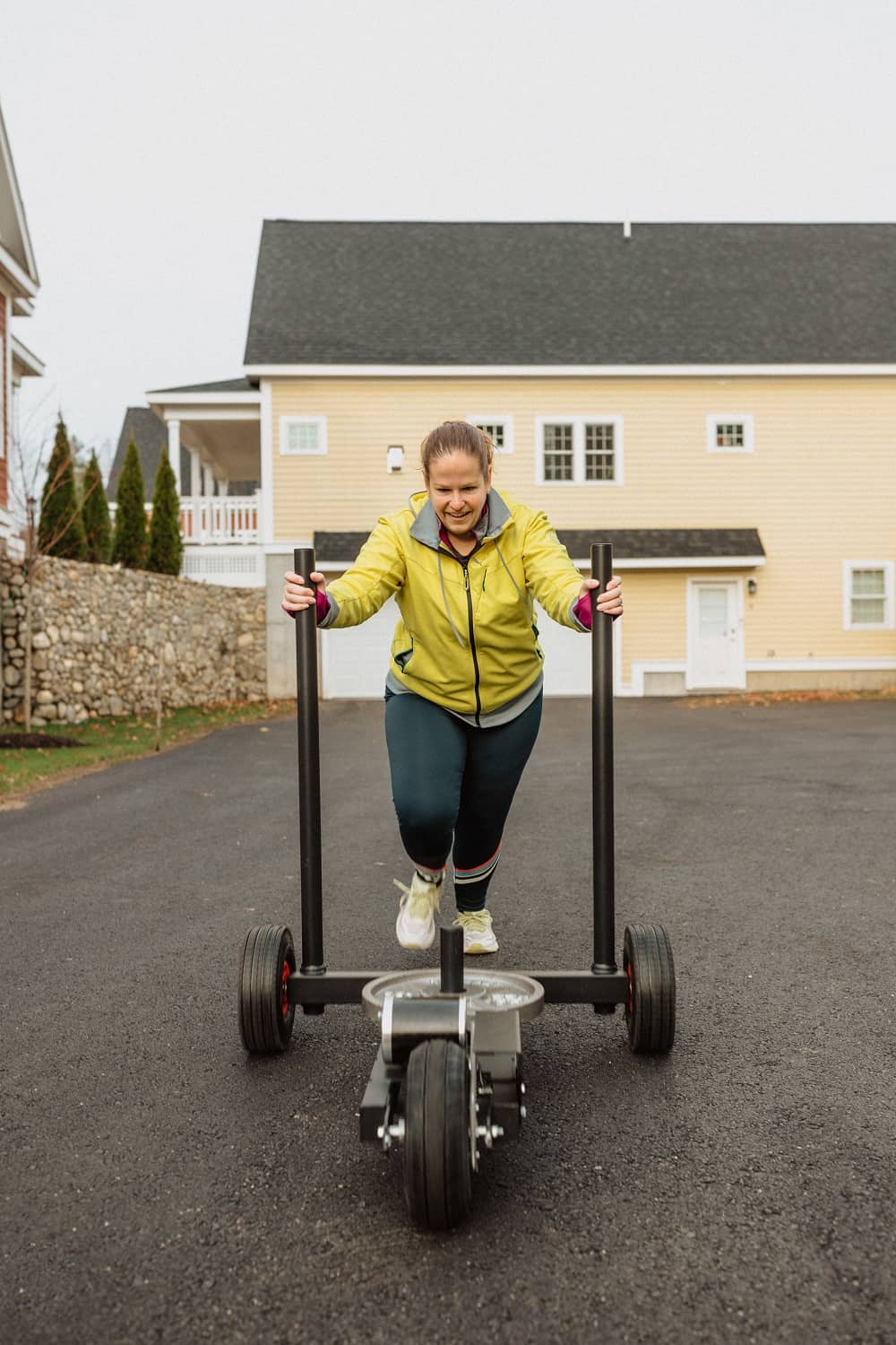 a woman doing a sled push workout