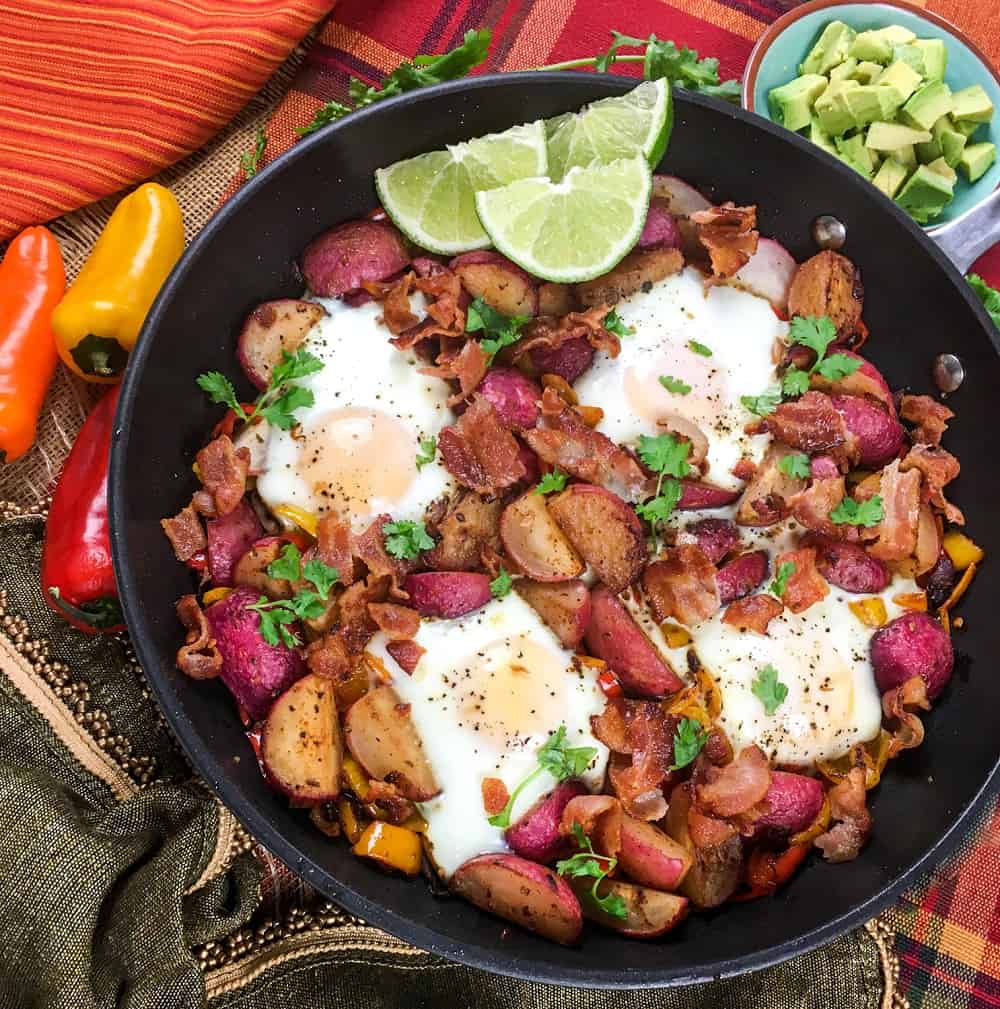 skillet filled with radishes, peppers, eggs, and bacon