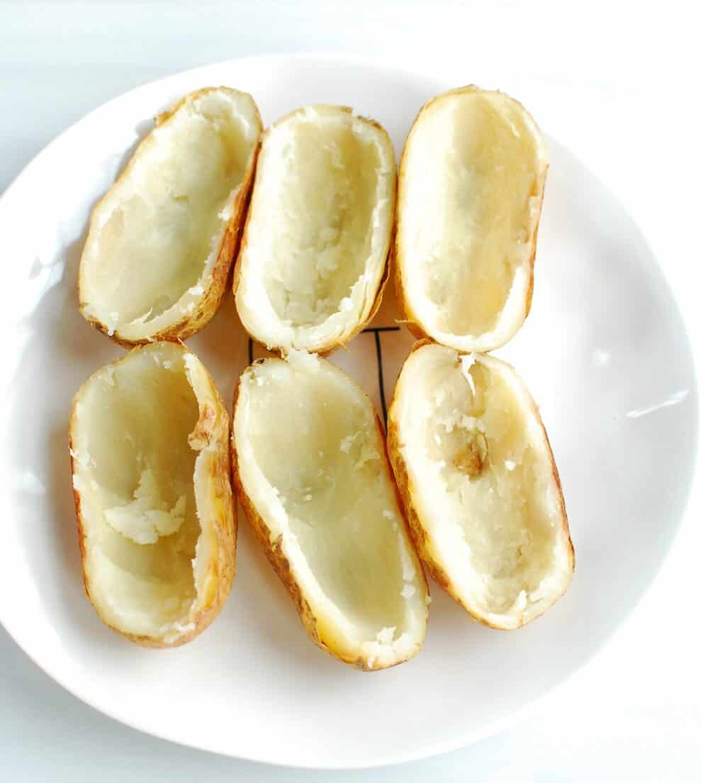 Potatoes with most of the flesh scooped out, leaving just the skins