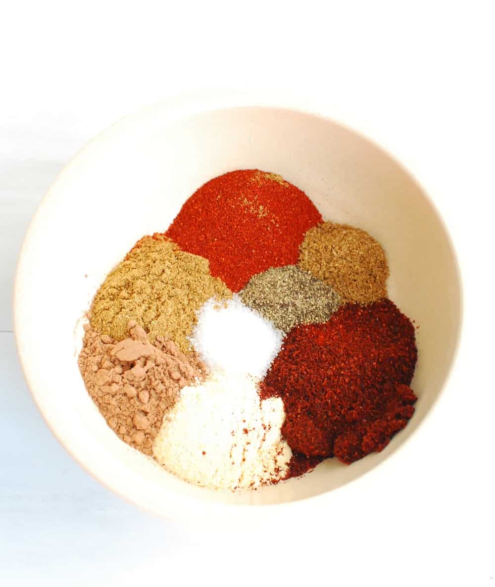 different spices in a bowl to season chili