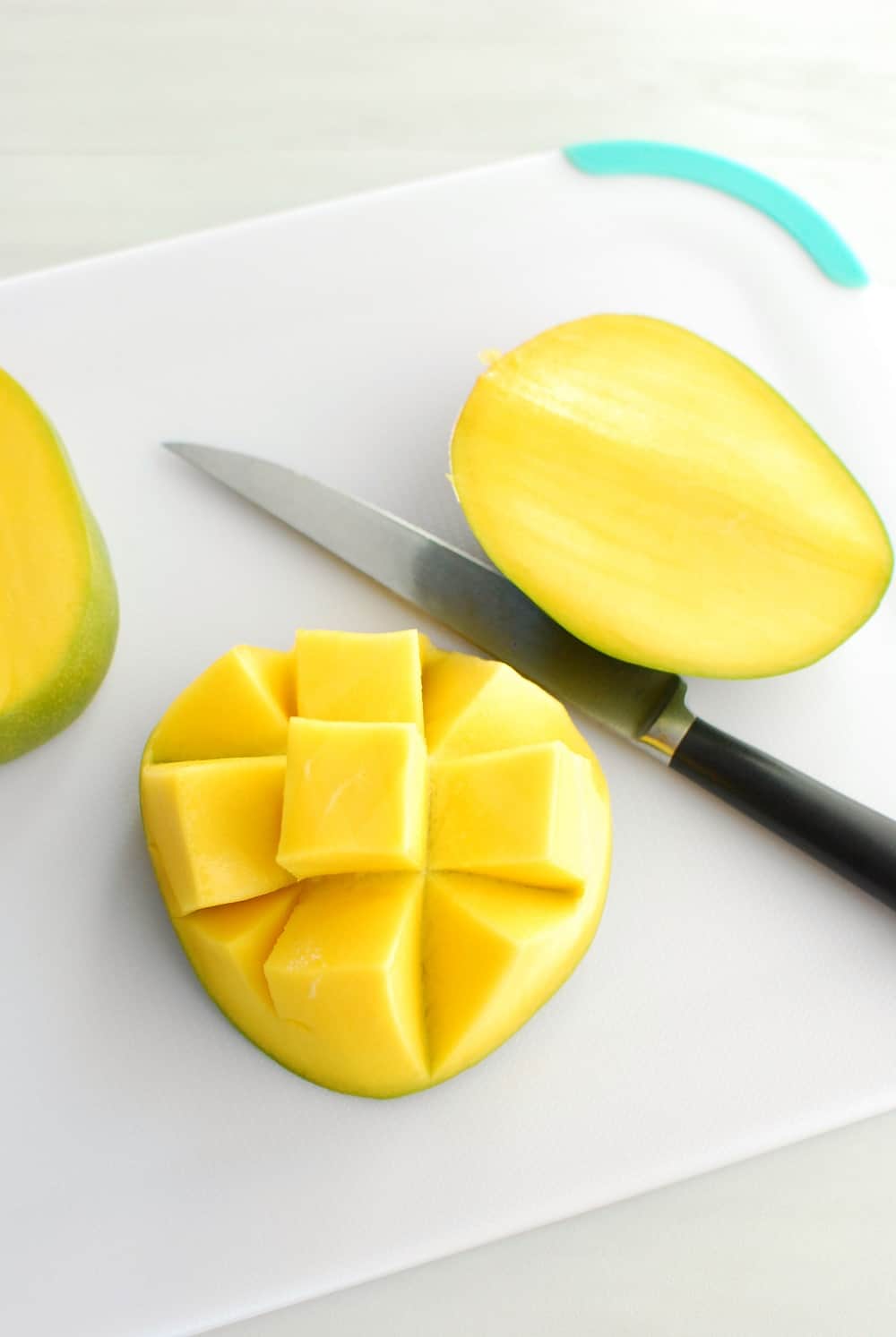 A mango cut in a checkerboard pattern