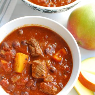 two bowls full of steak and mango chili