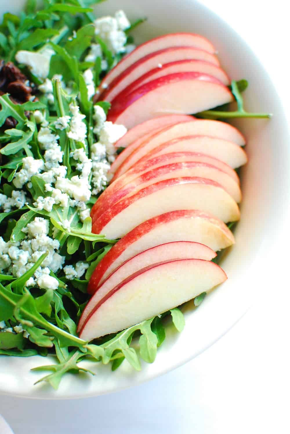 Close up of the apples in the arugula apple salad