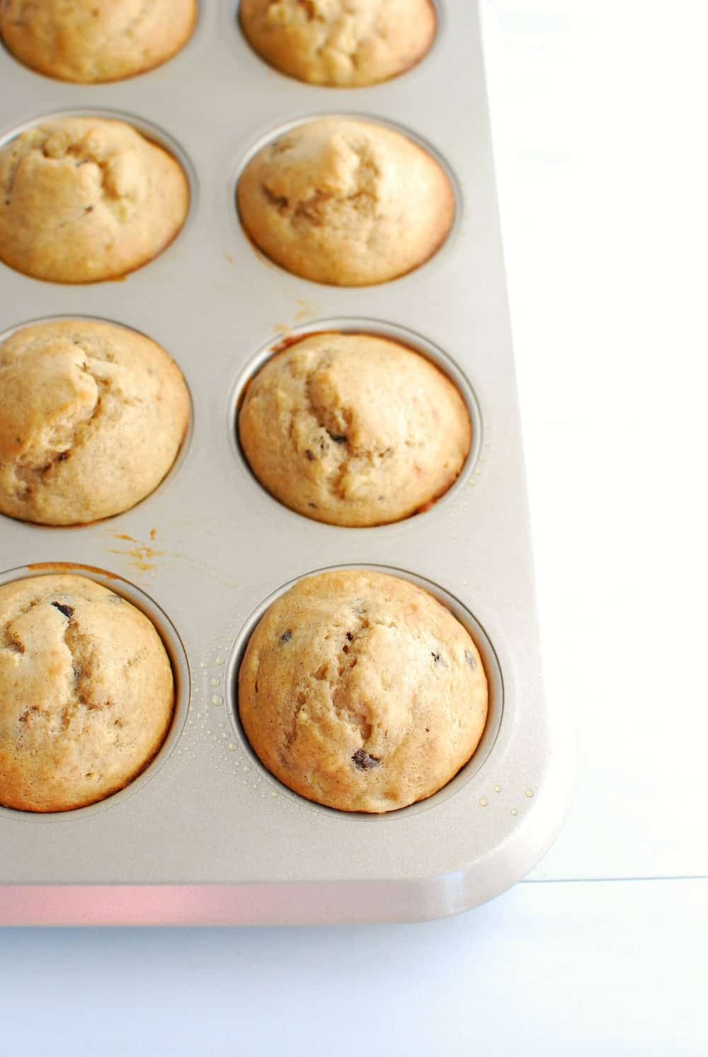 a pan full of baked banana protein muffins