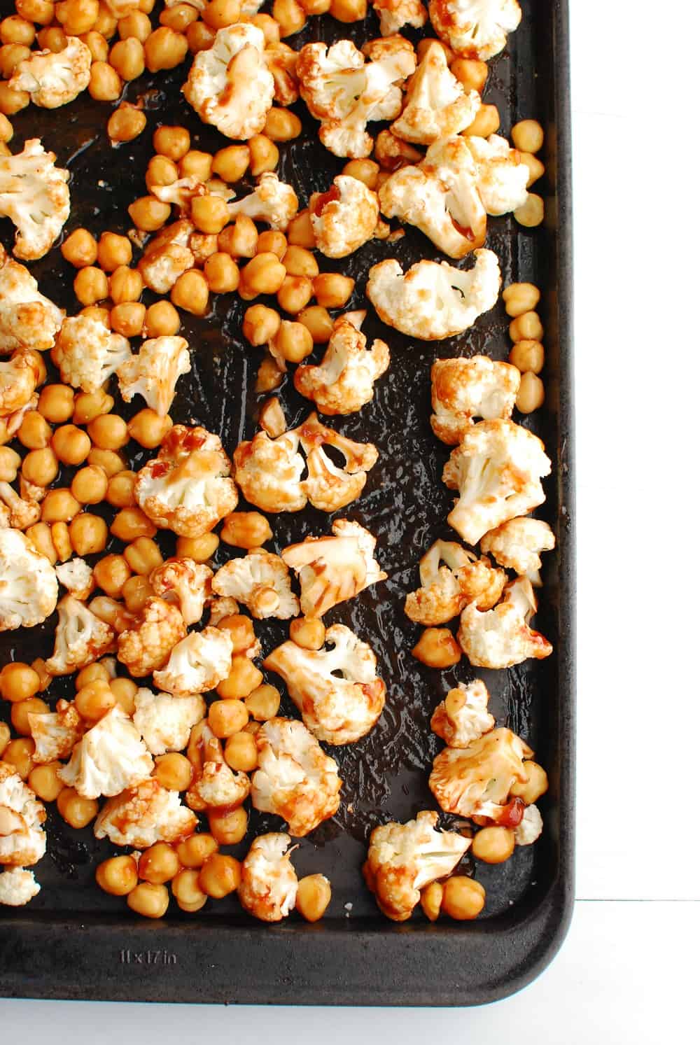 a pan full of cauliflower and chickpeas tossed in bbq sauce