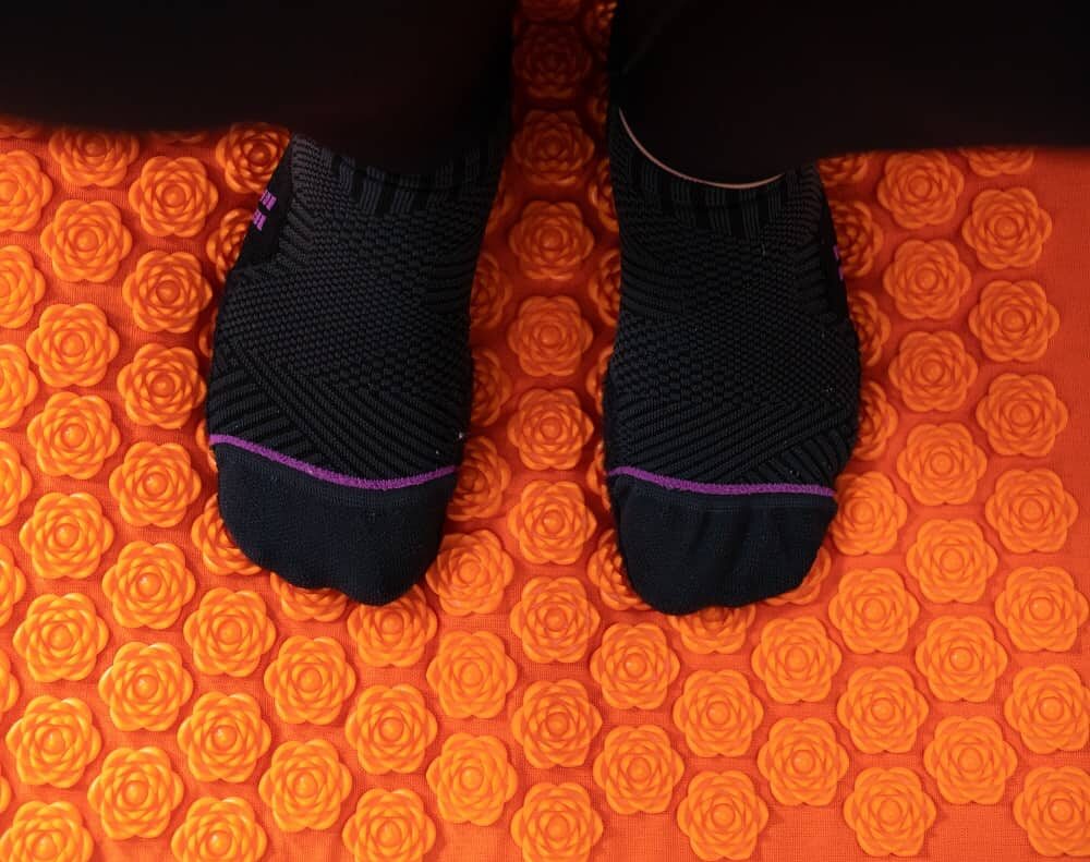 a person's feet on an acupressure mat