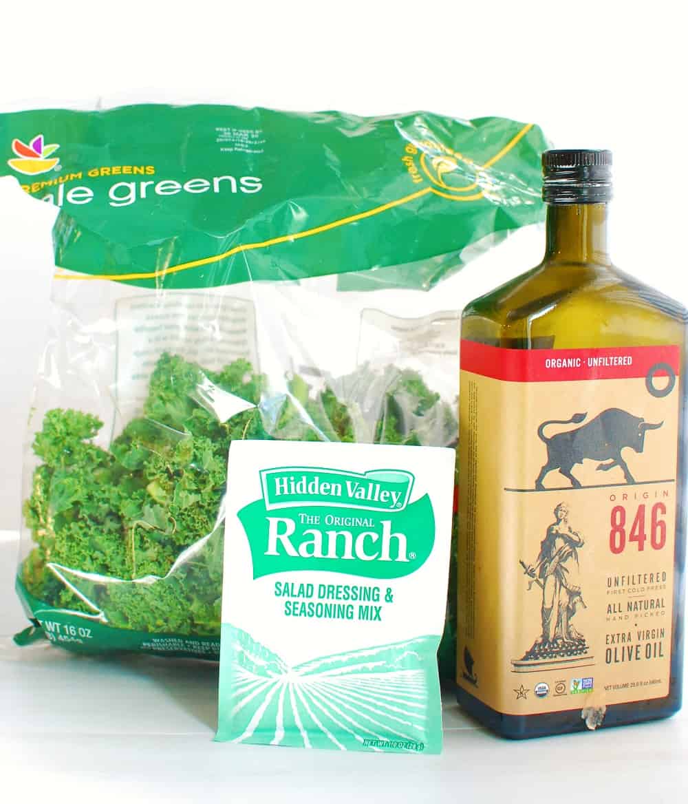 a bag of kale, a packet of ranch seasoning mix, and a bottle of olive oil