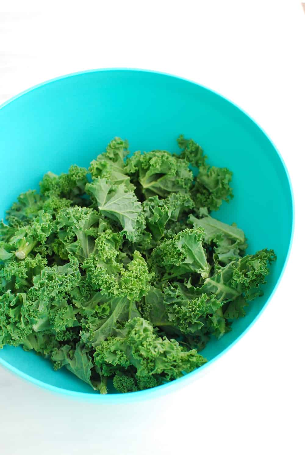 a bowl full of chopped kale