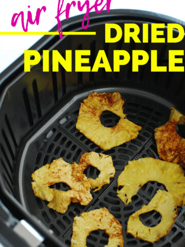 dehydrated pineapple in an air fryer basket