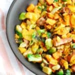sweet potato brussels sprouts hash in a skillet