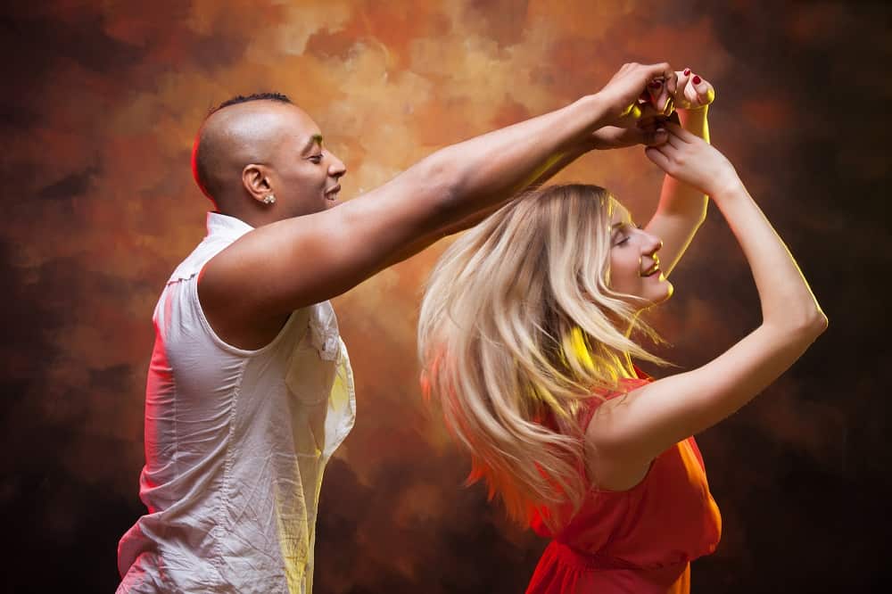 a couple doing salsa dancing together on a date