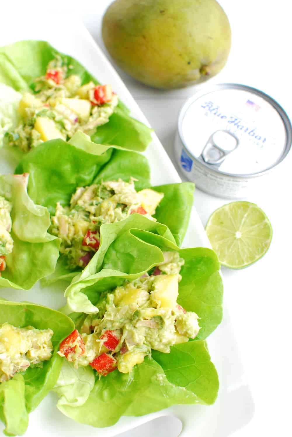 close up of tropical tuna salad scooped inside of a lettuce cup