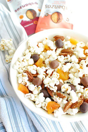 a bowl of popcorn trail mix