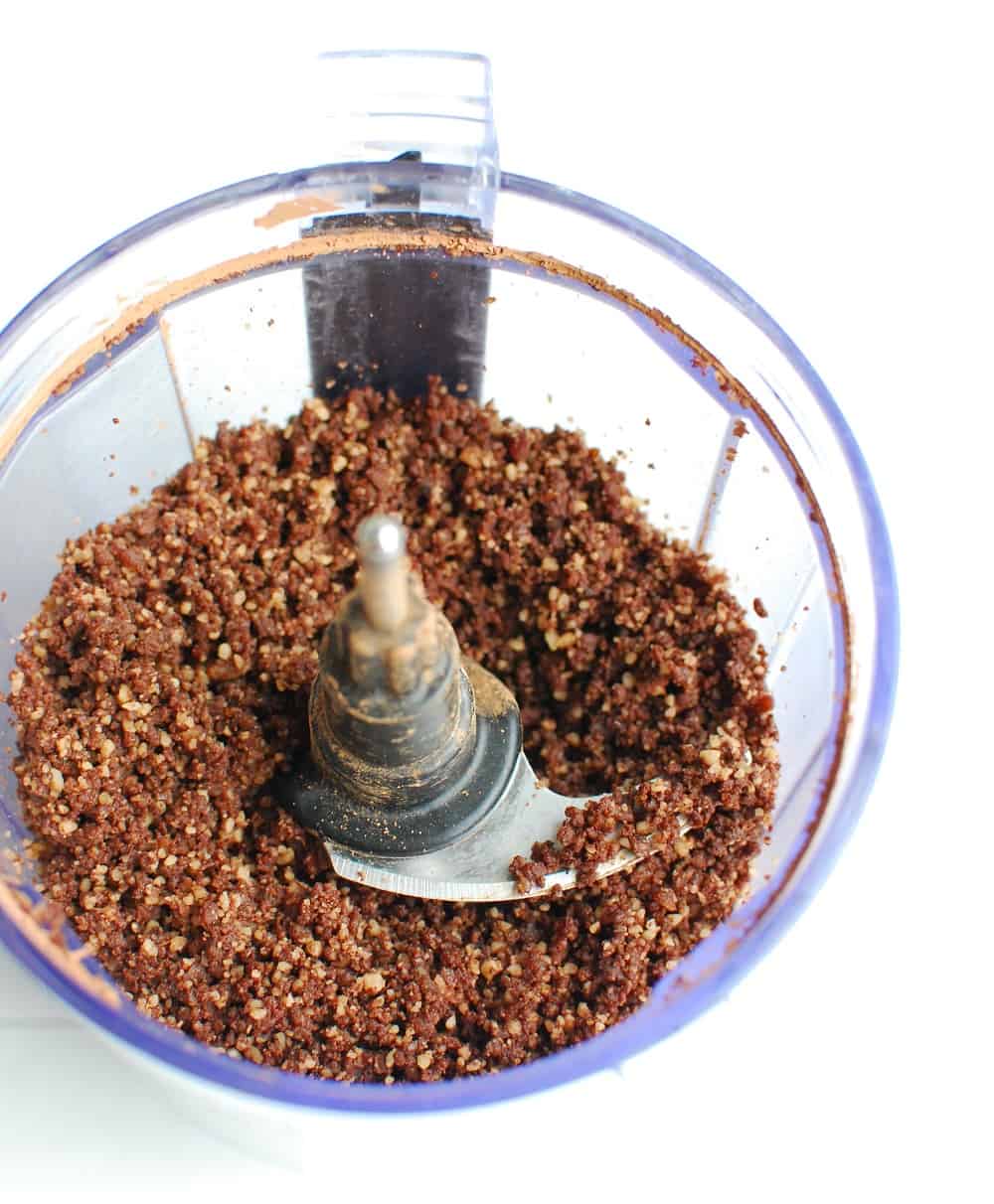 dates, nuts, and cocoa powder that has been processed together in a food processor