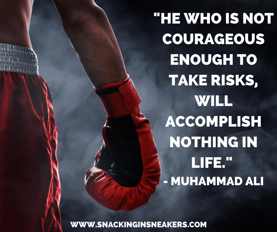 A man with boxing gloves on with a text overlay that says “He who is not courageous enough to take risks, will accomplish nothing in life.”