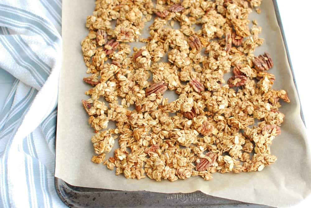 a baking sheet with just baked granola
