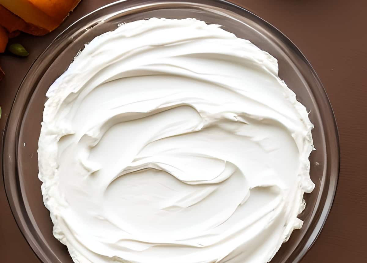 Cream cheese spread in a pie plate.