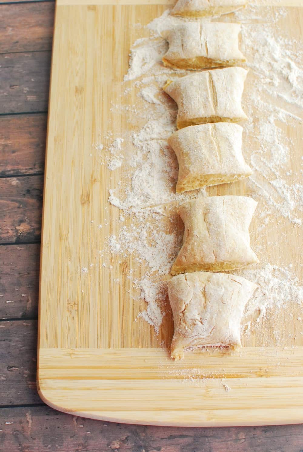 pasta dough rolled into a log and cut into six pieces