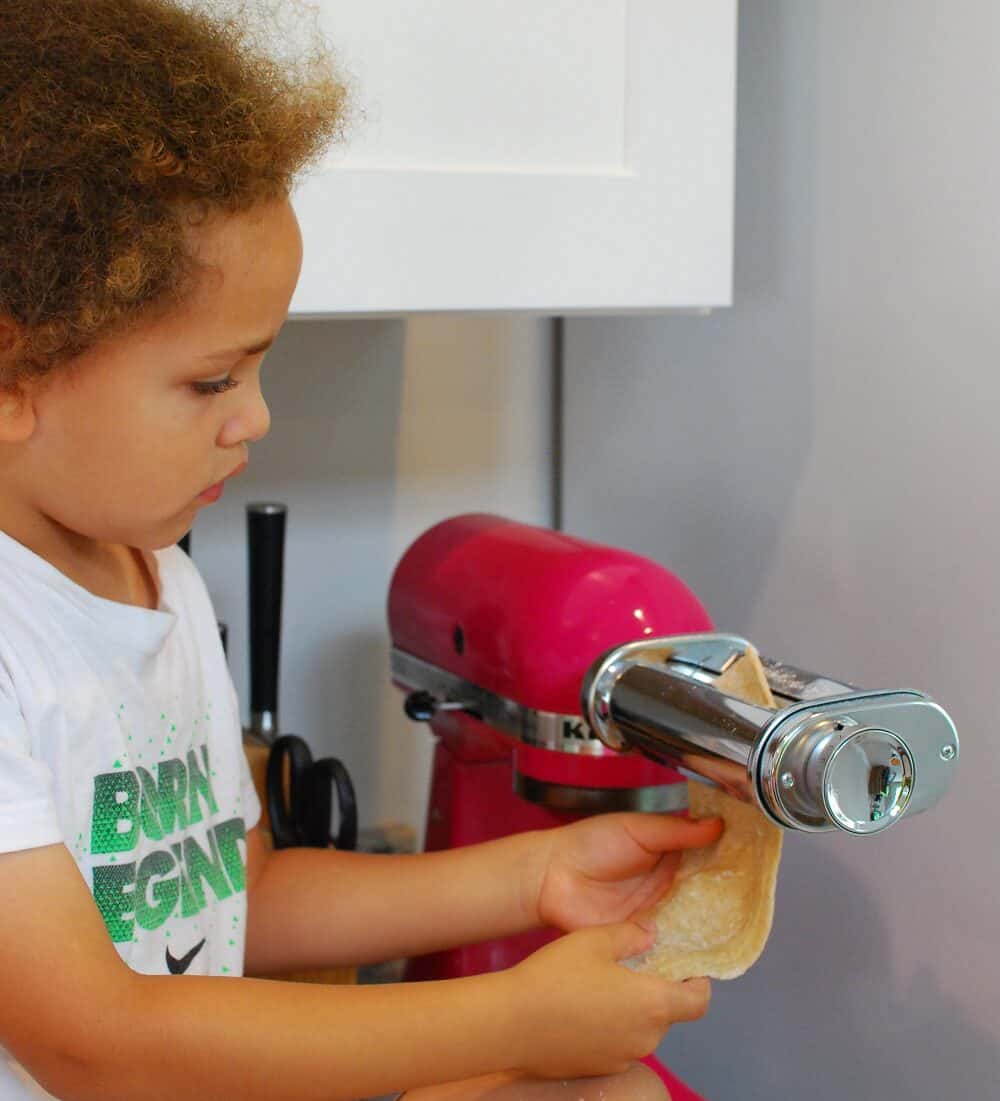 rolling pasta dough into sheets using a stand mixer