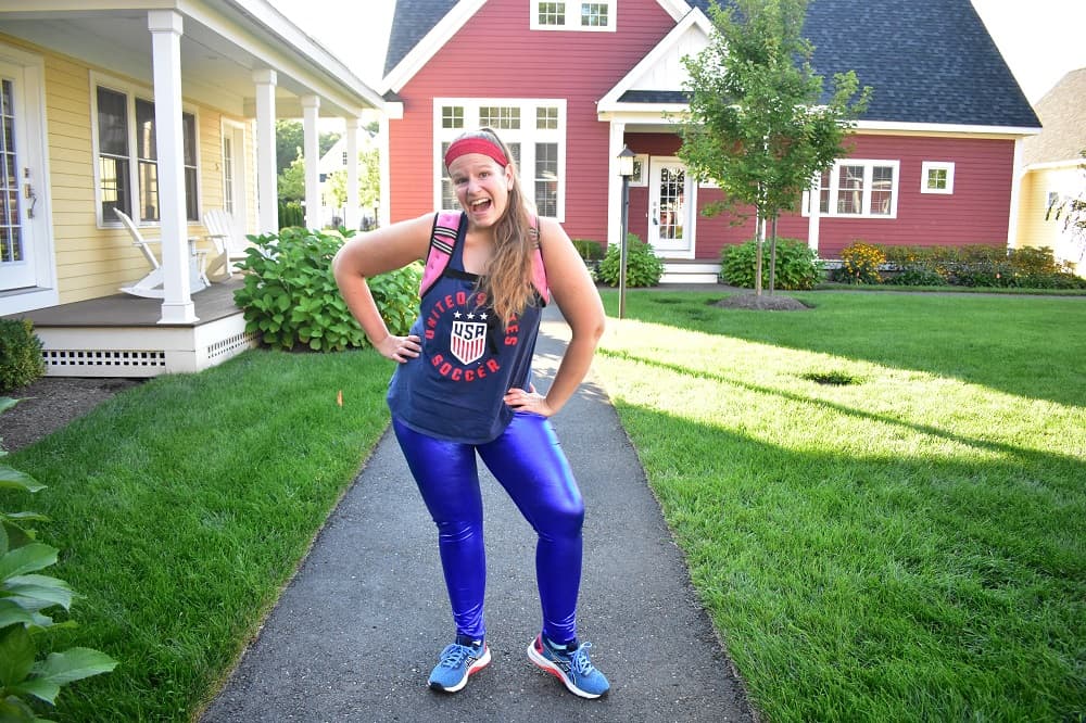 a woman dressed in patriotic running gear wearing a weighted running vest