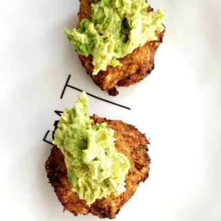 two air fryer salmon patties topped with avocado