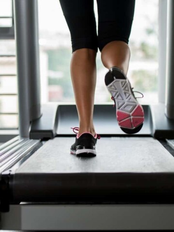 a woman's legs photographed during a HIIT treadmill workout